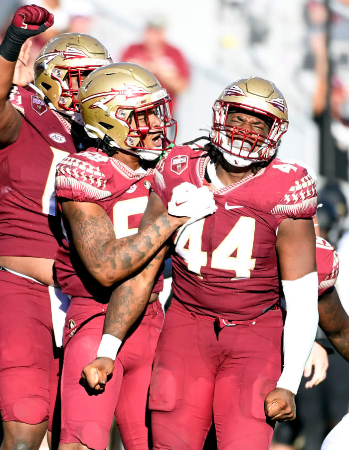 Oct 1, 2022; Tallahassee, Florida, USA; Florida State Seminoles defensive end Patrick Payton (56) celebrates a sack with defensive tackle Joshua Farmer (44) during the second half against the Wake Forest Demon Deacons at Doak S. Campbell Stadium.